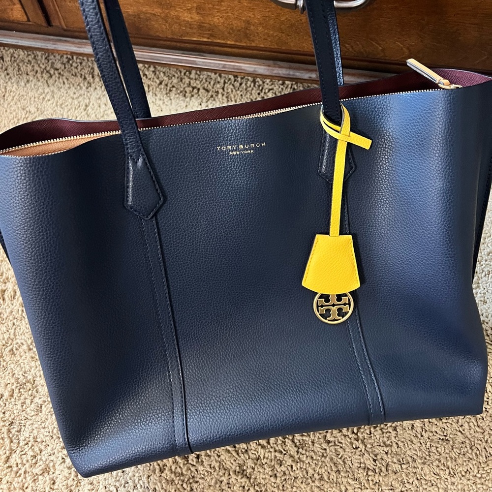 Tory Burch navy 100% leather Perry tote triple compartment.